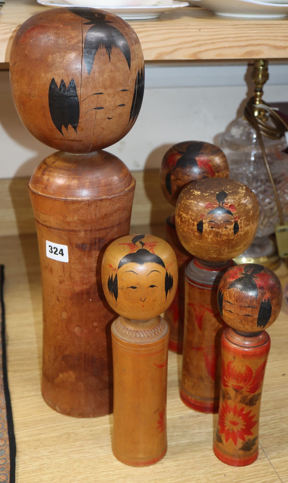 Five Japanese turned wood painted dolls, tallest 49cm